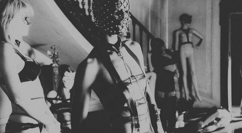 Beautiful black women with shaved head wearing sexy face covering.